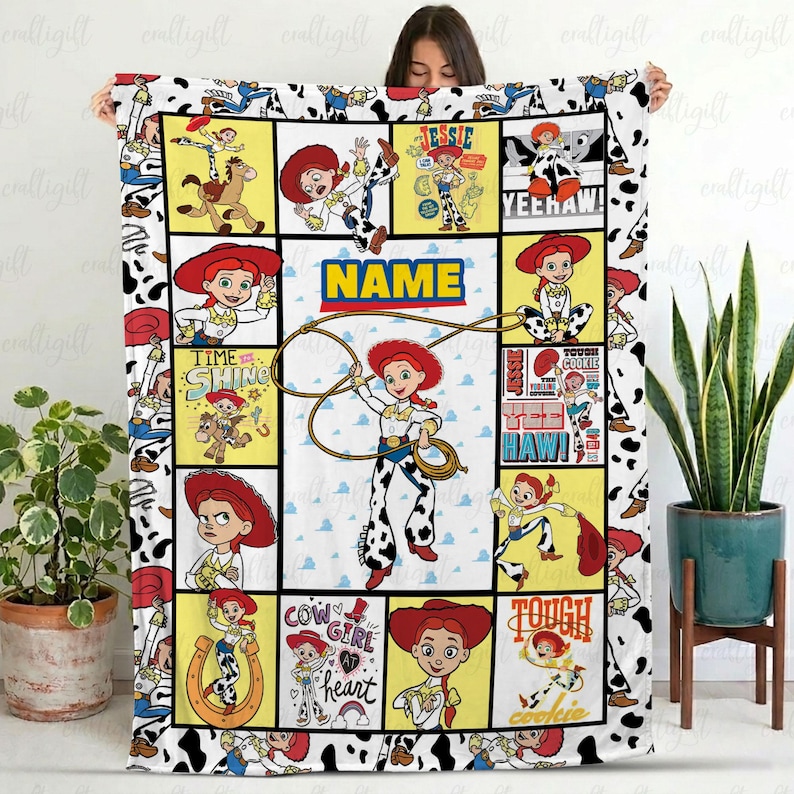 May include: A rectangular fleece blanket featuring a collage of Jessie the cowgirl from Toy Story in various poses. The design includes yellow and white panels with the text NAME, YEEHAW, TIME TO SHINE, COW GIRL AT HEART, and TOUGH COOKIE.