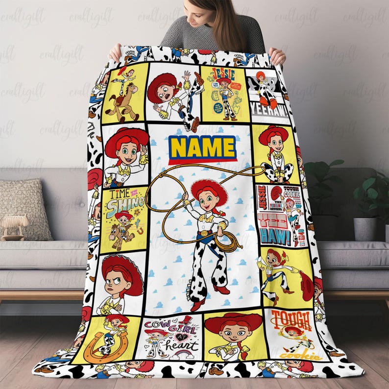 May include: A fleece blanket featuring a collage of Jessie the cowgirl from Toy Story in various poses, including holding a lasso. The design includes yellow and white panels with text such as NAME, TIME TO SHINE, and TOUGH COOKIE, all bordered by a black and white cow print pattern.