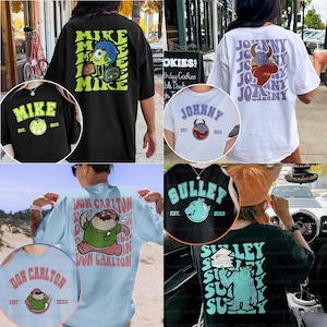 May include: Collection of graphic t-shirts featuring cartoon characters. Designs include "Mike", "Johnny", "Sulley", and "Don Carlton" with the year "2013". Shirts are in various colours, with front and back designs.