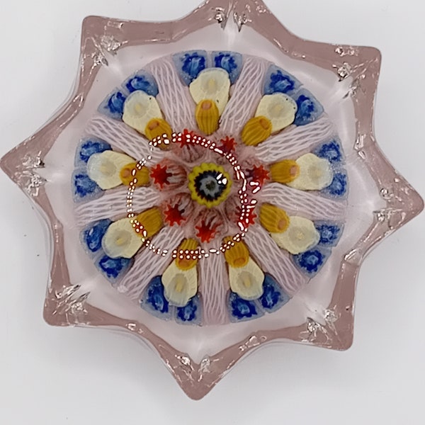 Beautiful vintage star shaped paperweight, millifiori and twisted canes.