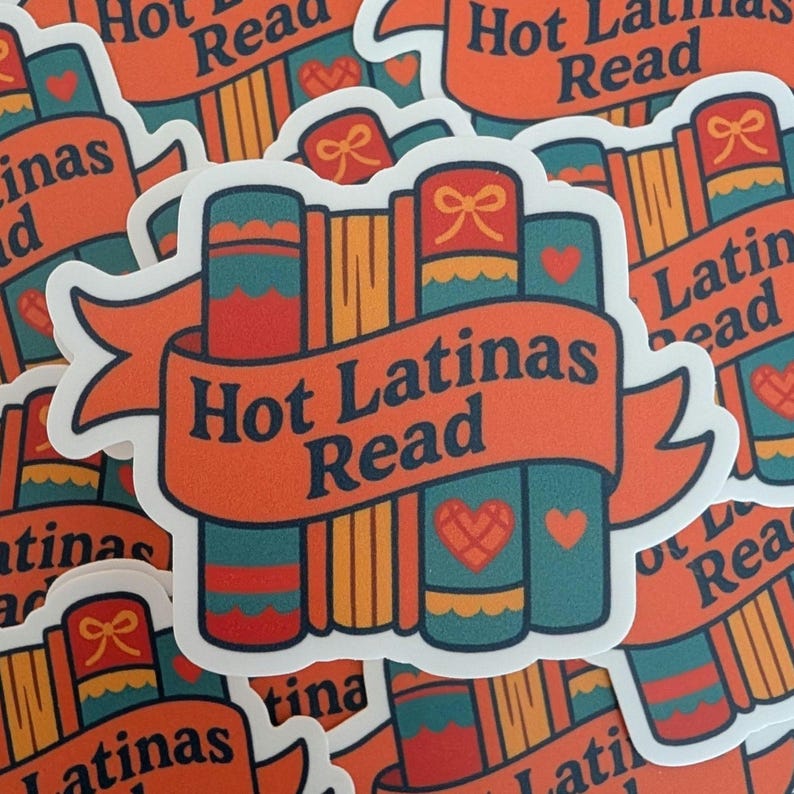 May include: A sticker featuring a stack of books with the text "Hot Latinas Read" on an orange banner. The books are teal, orange, and red with heart and bow details. The sticker has a white border and is scattered on a white surface.