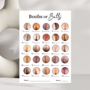 May include: A white card with the text "Boobs or Butts" and a series of numbered circles, each containing an image of a breast or buttock. The card includes spaces for a name and score.