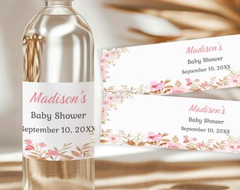 May include: Two pink and white floral baby shower water bottle labels with the text "Madison's Baby Shower September 10, 20XX".