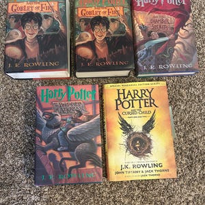 May include: Five hardcover books from the Harry Potter series by J.K. Rowling, including Harry Potter and the Goblet of Fire, Harry Potter and the Chamber of Secrets, Harry Potter and the Prisoner of Azkaban, and Harry Potter and the Cursed Child.