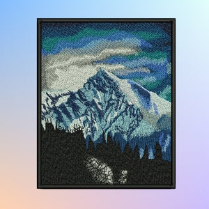 May include: Embroidered patch featuring a snowy mountain range with a blue and green sky. The mountain peaks are covered in snow and the sky is filled with clouds. The mountains are silhouetted against a dark forest in the foreground.