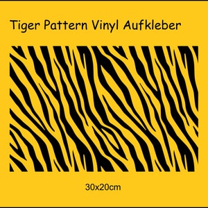 Könnte beinhalten: Schwarzer und gelber Vinyl-Aufkleber mit Tigerstreifenmuster. Der Aufkleber misst 30 cm x 20 cm.