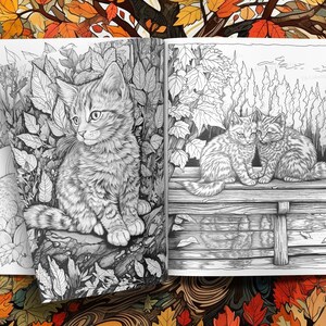 May include: A colouring book page featuring two cats sitting on a wooden fence. The cat on the left is looking to the right, while the cat on the right is looking straight ahead. The background features a woodland scene with trees and leaves.