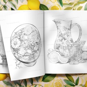 May include: A black and white illustration of a pitcher and glasses filled with lemonade. The pitcher and glasses are decorated with floral designs. There are lemons and limes around the pitcher and glasses.