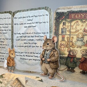 May include: A Christmas-themed pop-up book featuring illustrations of mice in winter settings. The book includes text about the Whiskerleaf family and their Christmas preparations, with a toy shop scene and various toys.