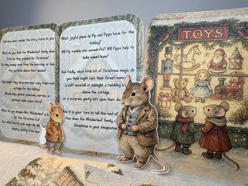 May include: A Christmas-themed pop-up book featuring illustrations of mice in winter settings. The book includes text about the Whiskerleaf family and their Christmas preparations, with a toy shop scene and various toys.