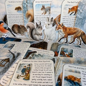 May include: A collection of illustrated cards featuring winter wildlife scenes. The cards depict animals like a red fox, squirrel, and hare, with accompanying text. The artwork has a watercolor style, with a focus on nature and storytelling.