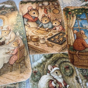 May include: A collection of Christmas-themed illustrations featuring anthropomorphic mice. Scenes include baking gingerbread cookies, enjoying a holiday meal, and admiring a snowy winter landscape. The artwork has a warm, inviting color palette.