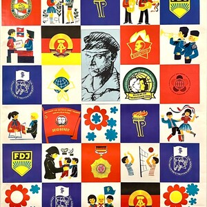 May include: A colorful poster with the text "1. Zentrales Rätetreffen der Pionierorganisation, Ernst Thälmann" and "Dresden, 17.-21.August 1972". The poster features a grid of 16 squares with various images and symbols, including a red flag with a hammer and sickle, a blue flag with a torch, and a yellow flag with the letters "FDJ".