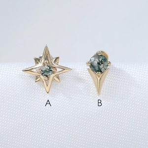 May include: Two gold stud earrings featuring moss agate stones. Earring A is shaped like a four-pointed star with a central stone. Earring B is a triangular-shaped stud with a central stone. The letters A and B are printed below each earring.