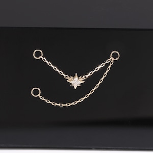 Örhänge i 14 karat massivt guld med diamanter och stjärnkedja, Moissanit med polaris-broskkedja, Celestial Helix-kedja med tragus och conch-liknande.