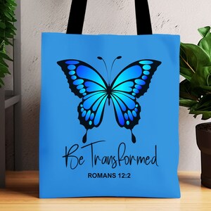 May include: A blue tote bag with a blue butterfly and the text "Be Transformed" and "Romans 12:2".