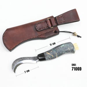 May include: A curved, stainless steel knife with a green and black wood handle and a brown leather sheath. The knife is 7 inches long and the sheath is 11 inches long. SKU: 71069