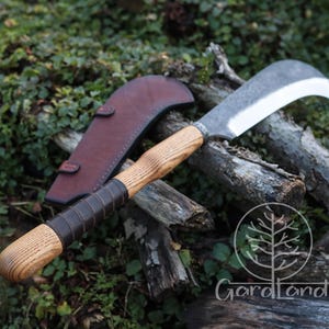 May include: A curved blade knife with a wooden handle and leather grip. The blade is silver and the handle is light brown. A brown leather sheath is visible in the background. The knife is designed for cutting and chopping.
