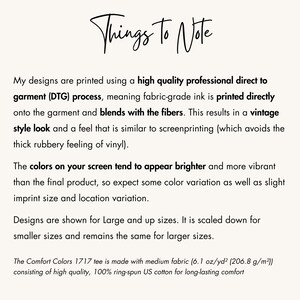 May include: Text explaining the printing process used for designs on t-shirts. The text mentions direct to garment (DTG) printing, fabric-grade ink, and a vintage style look. It also notes that colors may appear brighter on screen than in person and that designs are scaled down for smaller sizes.