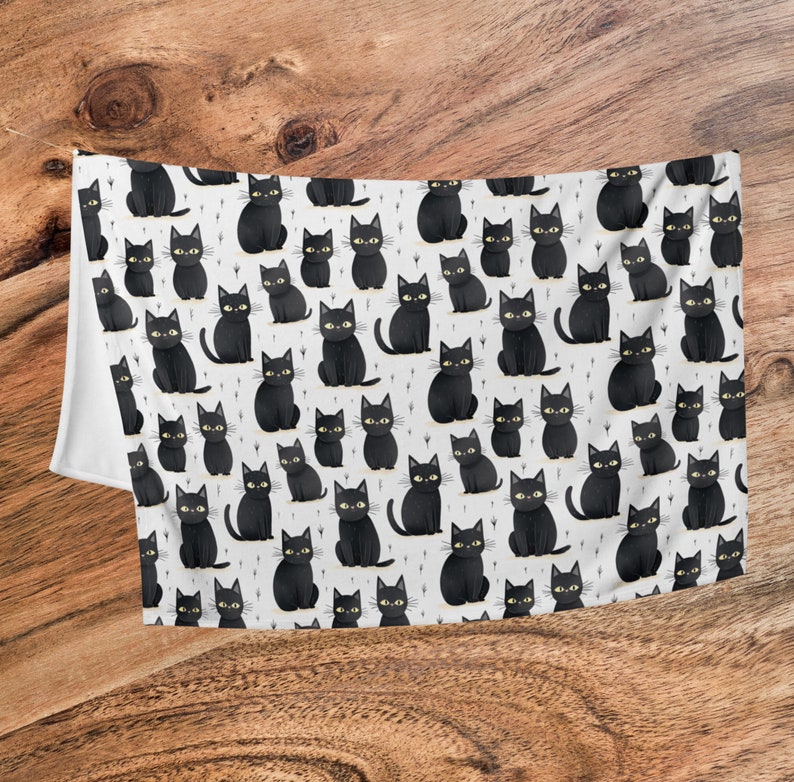 May include: A white background with a repeating pattern of black cats. The cats are all facing forward with their tails curled behind them. They have yellow eyes and are sitting in a variety of poses.