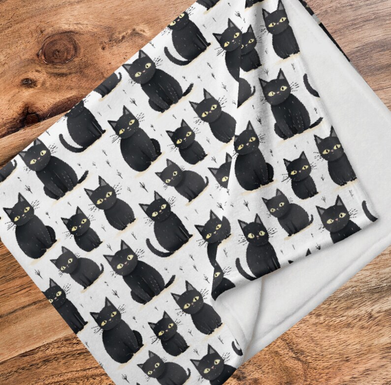 May include: White fabric with a black cat pattern. The cats are all facing forward with their tails curled up. The fabric has a white background with a subtle pattern of small black dots.