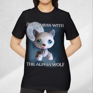 May include: Black t-shirt with a white wolf cartoon illustration and the text "Don't mess with the alpha wolf".