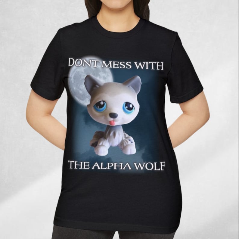 May include: Black t-shirt with a white wolf cartoon illustration and the text "Don't mess with the alpha wolf".
