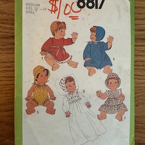 May include: Simplicity sewing pattern number 8817 for making doll clothes. The pattern includes five different outfits for a 15-16 inch doll. The outfits include a red dress, a blue coat, a white gown, a yellow jumpsuit, and a floral print dress.