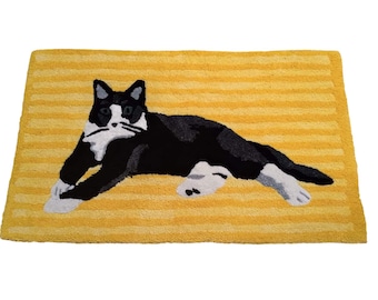 Beautiful thick carpet with a cat, yellow, black cat, tuxedo cat on a yellow background, high quality handmade carpet, tufted carpet bedroom