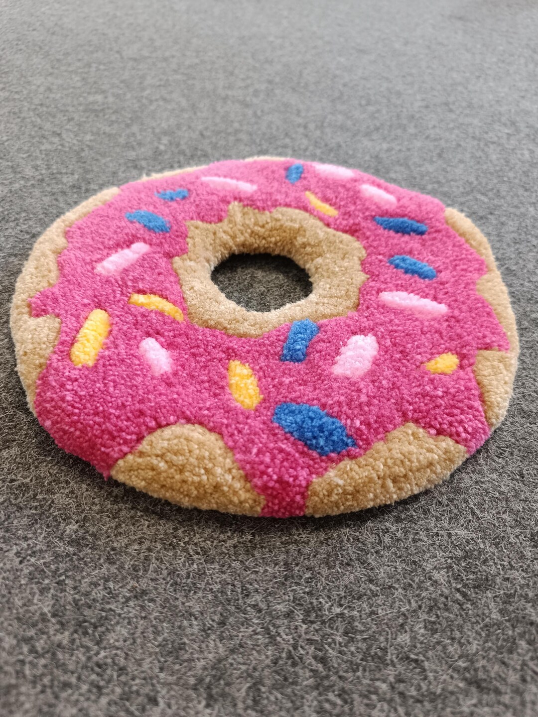 A Donut, a Tufted Rug, a Wall Decoration, a Table Decoration. A ...