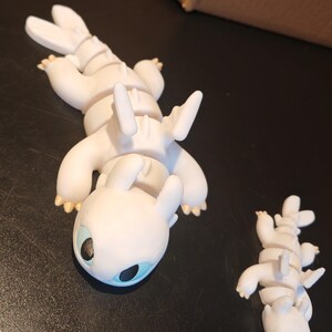 Artikulerande babyljus / Fidget sensorisk leksak / Hur man tränar sin drake bild 5