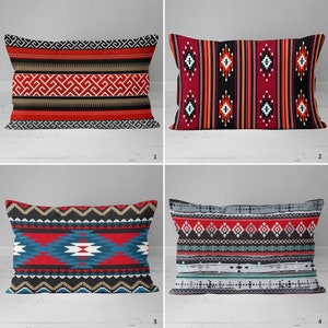 May include: Four decorative throw pillows with geometric patterns in red, black, white, blue, and grey. The pillows are arranged in a grid pattern on a white wooden surface.