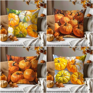 May include: Four decorative throw pillows with pumpkin designs. Pillows feature various pumpkin arrangements in shades of orange, yellow, and white. The pillows are placed on a couch with pumpkins and fall foliage.