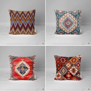 May include: Four decorative throw pillows with different geometric patterns. The pillows are red, blue, yellow, and brown with intricate designs.