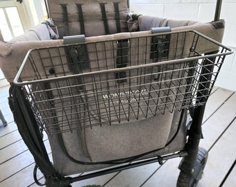 May include: A black metal wire basket is attached to the back of a gray wagon. The wagon has a black fabric seat and black wheels.