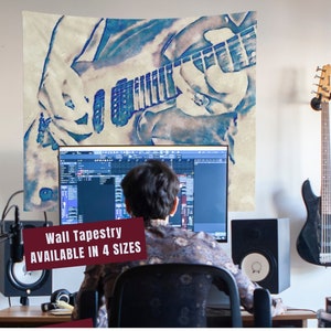May include: A blue and white watercolor-style wall tapestry featuring a person playing an electric guitar. The text "Wall Tapestry AVAILABLE IN 4 SIZES" is at the bottom of the tapestry.