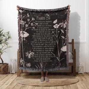 May include: Black and white woven throw blanket with a floral pattern and the text "Psalm 23" and the text of the 23rd Psalm.