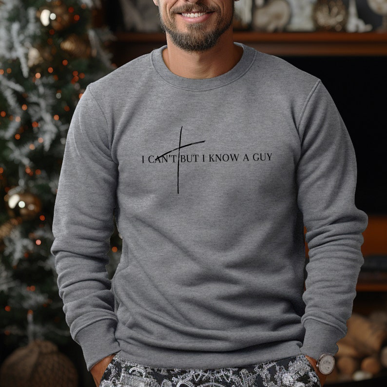 May include: A gray sweatshirt with the text "I can't but I know a guy" and a cross graphic.