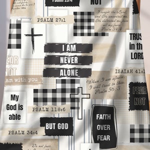 May include: A white and black checkered throw blanket with inspirational quotes and bible verses. The blanket features a black and white checkered pattern, a cross, and the words "Fear Not", "I Am Never Alone", "Trust God", "Faith Over Fear", and "But God".