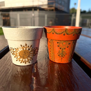 Handmade own designs on mini flower pots