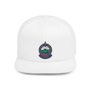 May include: White baseball cap featuring an embroidered emblem with a mountain landscape in green, blue, and white. The emblem is surrounded by a decorative border in purple and gold. The cap has a flat brim and a structured fit.