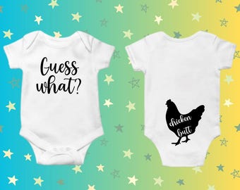 May include: Two white baby onesies. The front of one onesie says "Guess what?" and the back of the other onesie has a black silhouette of a chicken with the text "chicken butt" underneath.