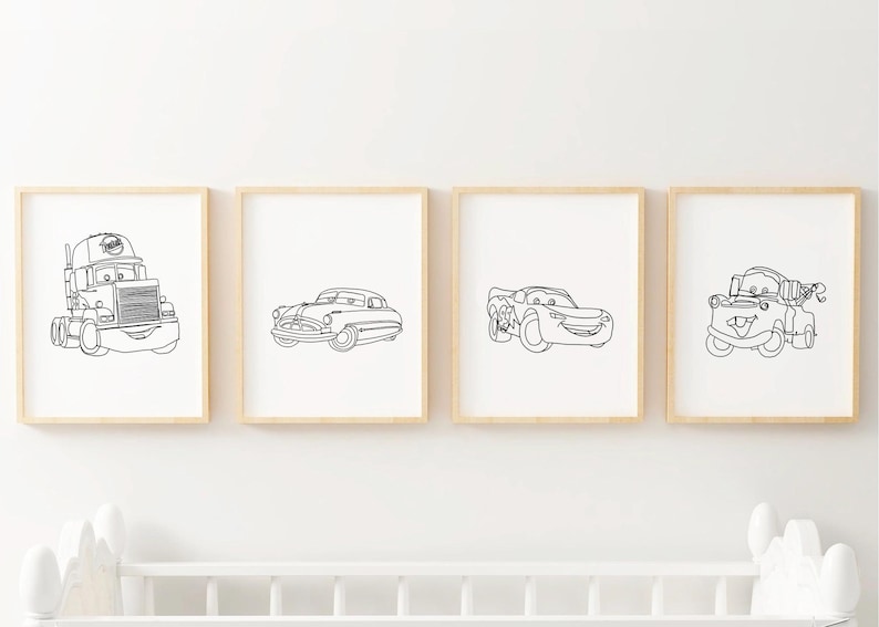 May include: Four black and white line art prints of cars from the Disney Pixar movie Cars. The prints are framed in simple wooden frames and are displayed on a white wall.