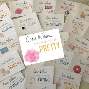 May include: A set of 15 cards with different phrases and illustrations. Each card has the words "Open When..." followed by a phrase like "You Need to Feel Pretty" or "You Need a Shopping Day".