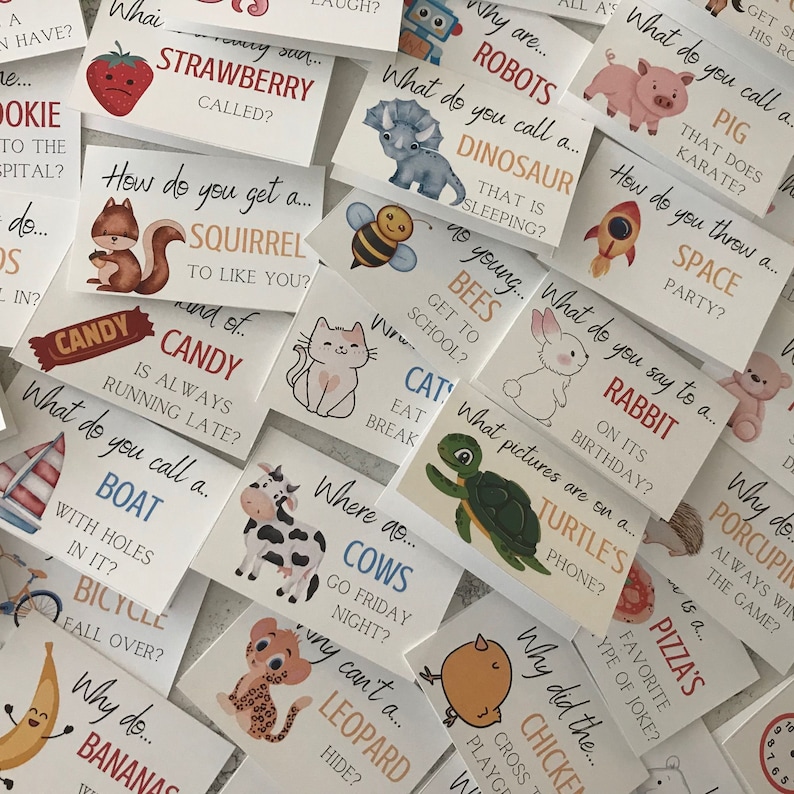 May include: A set of colourful cards with animal illustrations and riddles. Each card features a different animal, such as a squirrel, a cow, a turtle, a bee, a cat, a rabbit, a dinosaur, a robot, a pig, a leopard, a banana, a boat, a bicycle, a chicken, a pizza, and a porcupine. The cards are printed on white cardstock and have rounded corners.