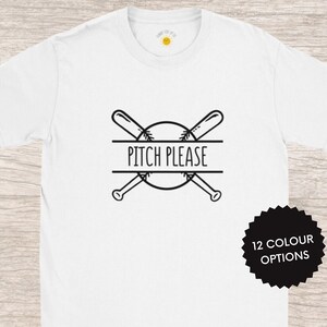 May include: White t-shirt with a black baseball graphic and the text "Pitch Please".