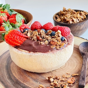 Nutritious and colorful Acai bowl with Canela granola on top.