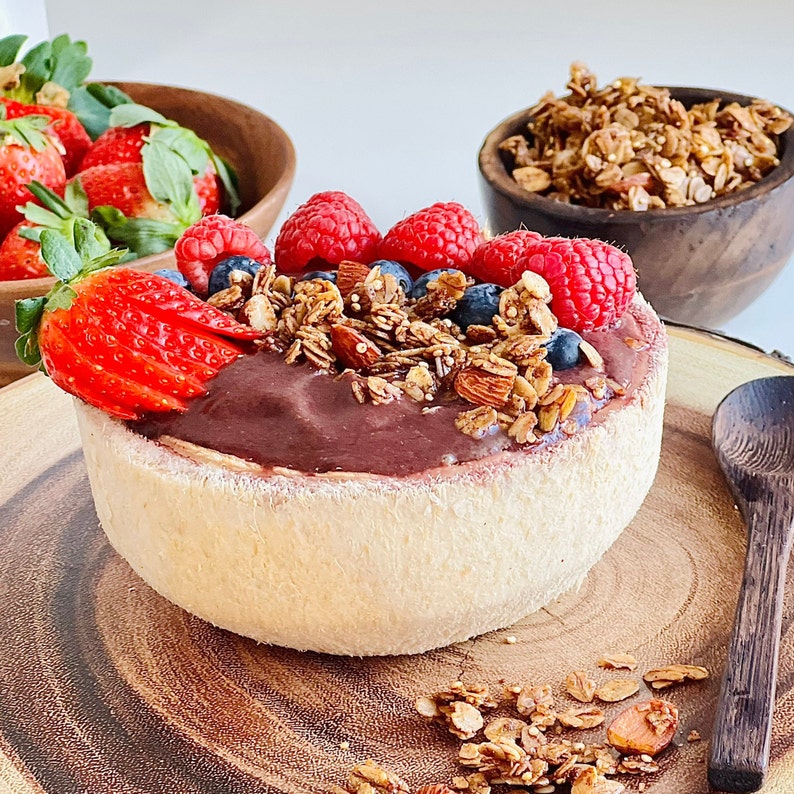 Nutritious and colorful Acai bowl with Canela granola on top.