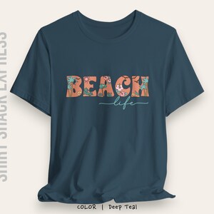 Retro font decorated with beach accents that says Beach life on a t-shirt