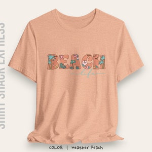 Retro font decorated with beach accents that says Beach life on a t-shirt